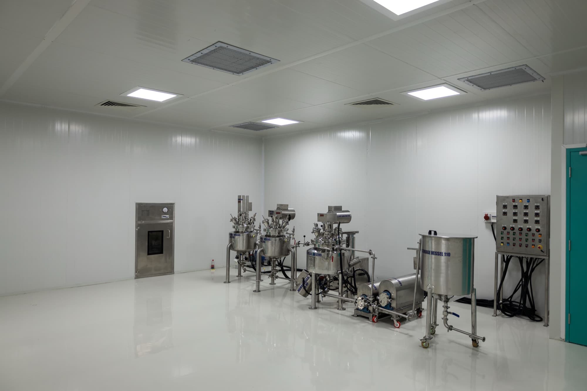 Cosmetics production room with mixing vessels