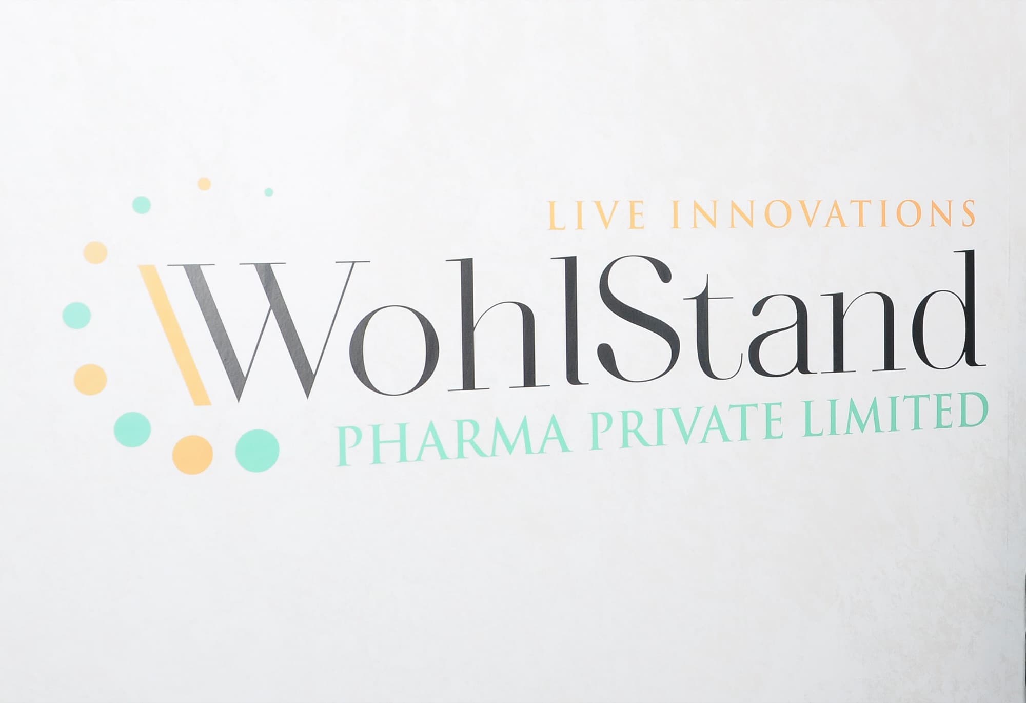 The WohlStand Pharma logo on the reception wall